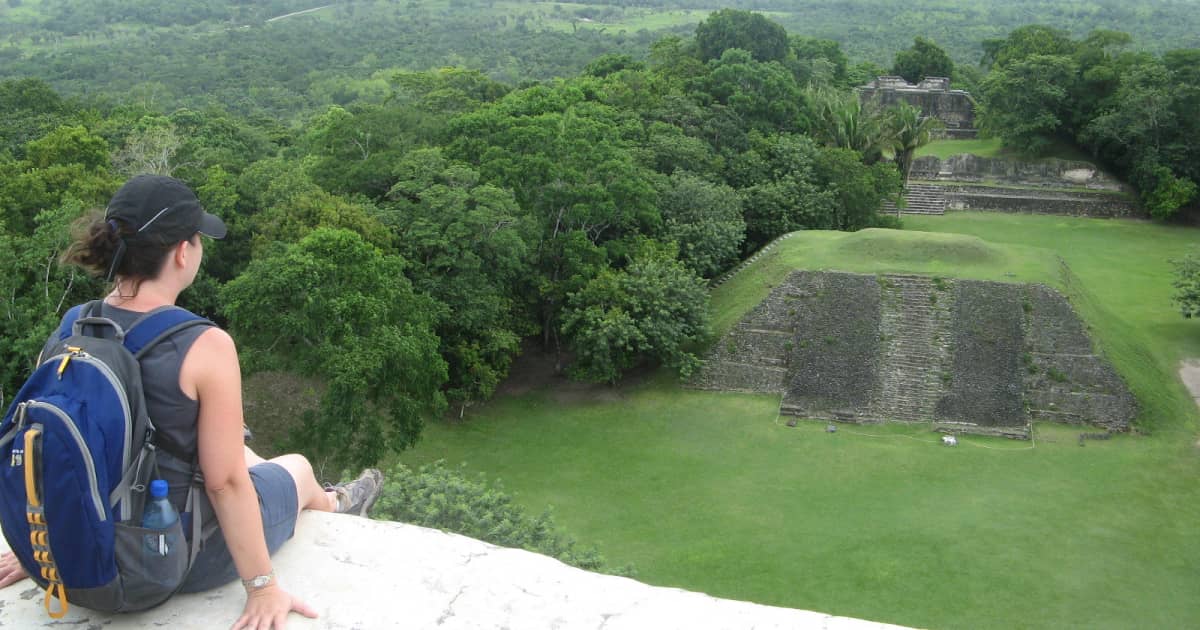 adventure traveler admiring the mayan ruins