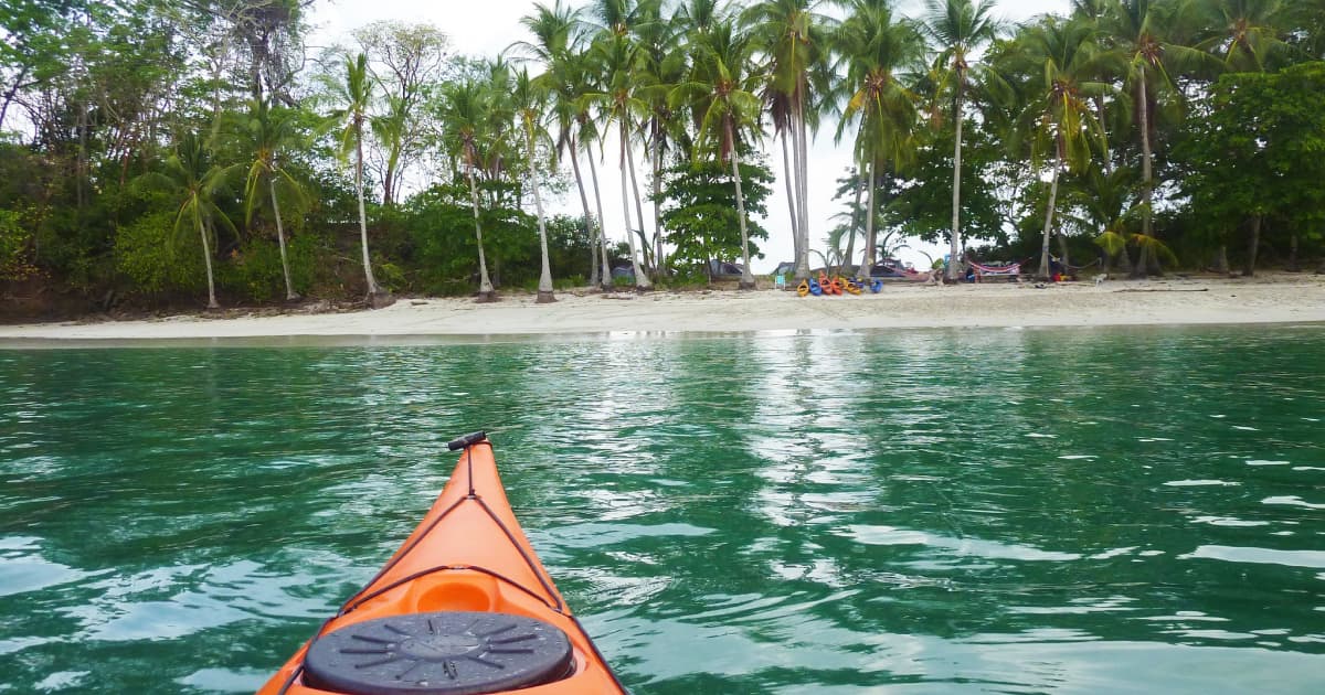 kayaking beside a beach