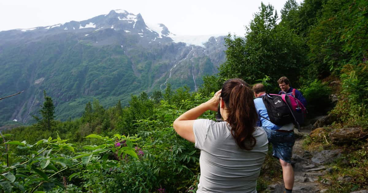 group of hikers admiring the mountain view