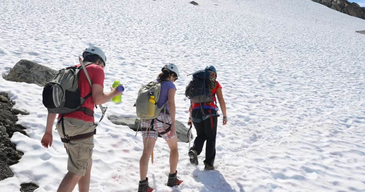 group trekking in the snow