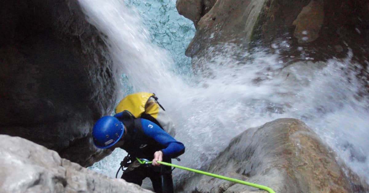 canyoning down into a water rapid