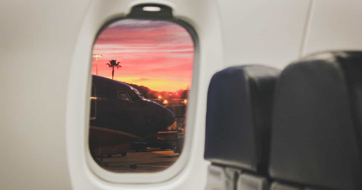 Airplane Window View Of Sunset