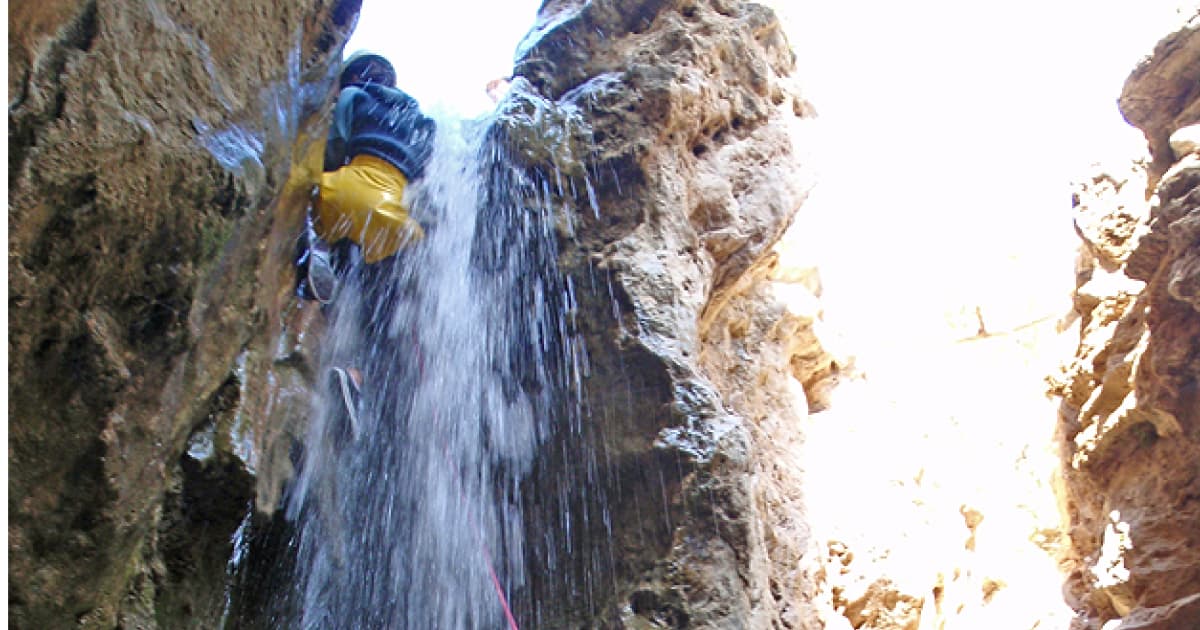 Canyoneering down a waterfall