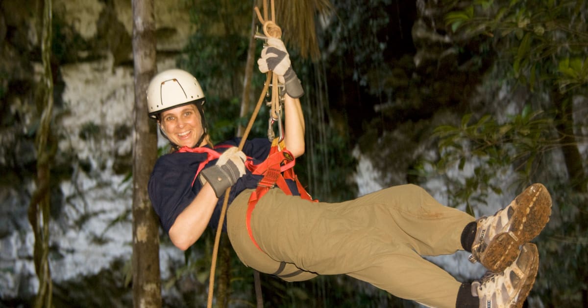 rappelling down a canyon