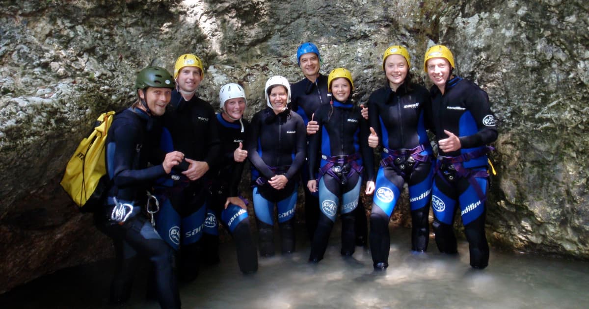 a group of travelers at the bottom of a cave