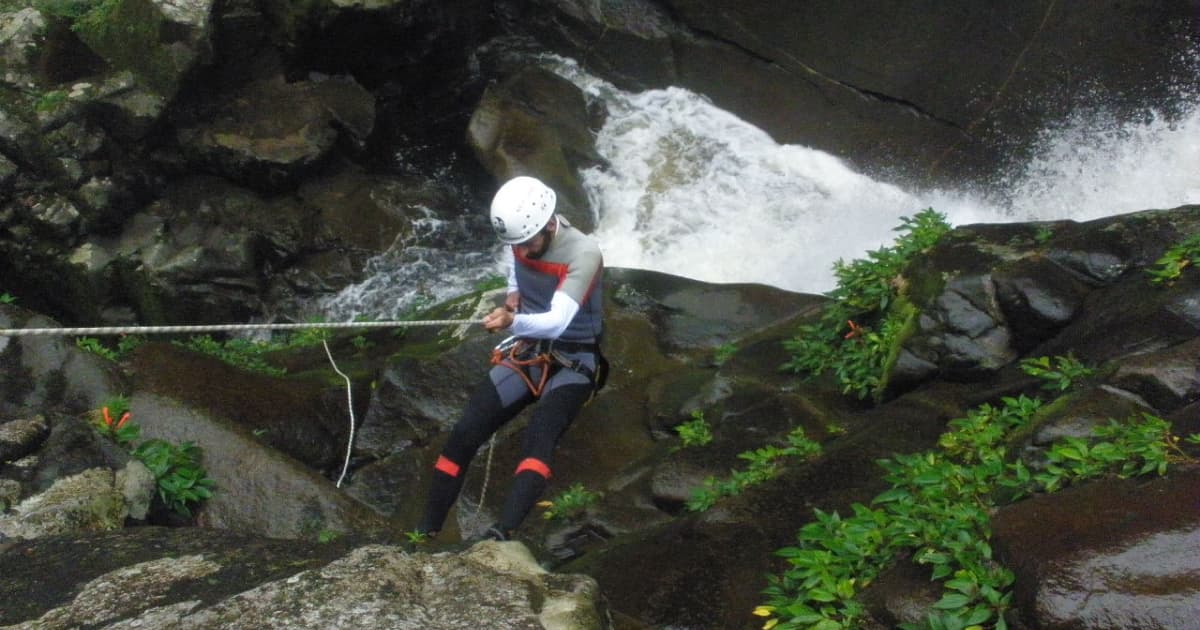 climbing down a waterfall edge