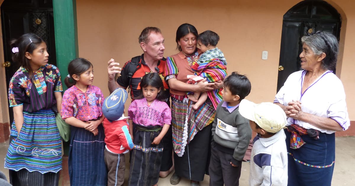 Traveler chatting with vietnamese villagers