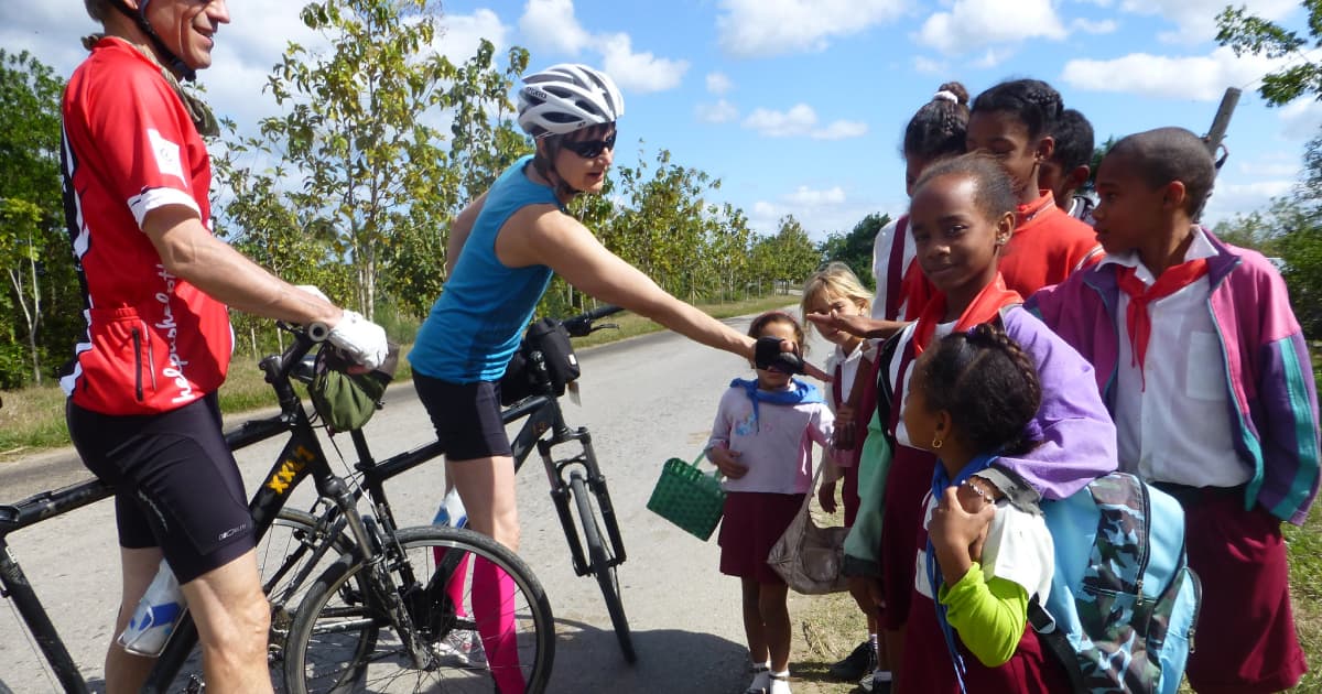 Cyclists stopping to meet a local family