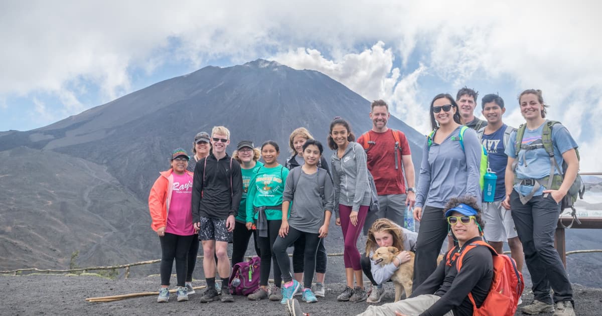 Family adventure group on a volcano in Guatemala