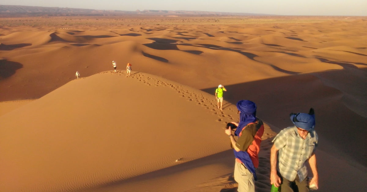 Group hiking Sahara desert