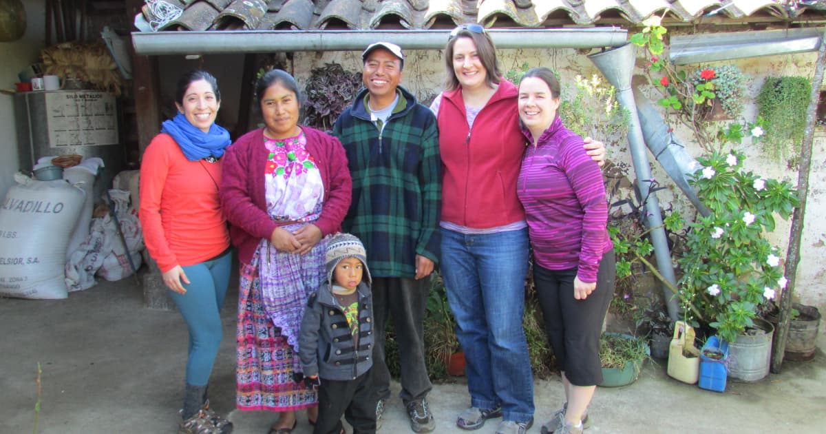 Meg with a local family at a homestay in guatemala