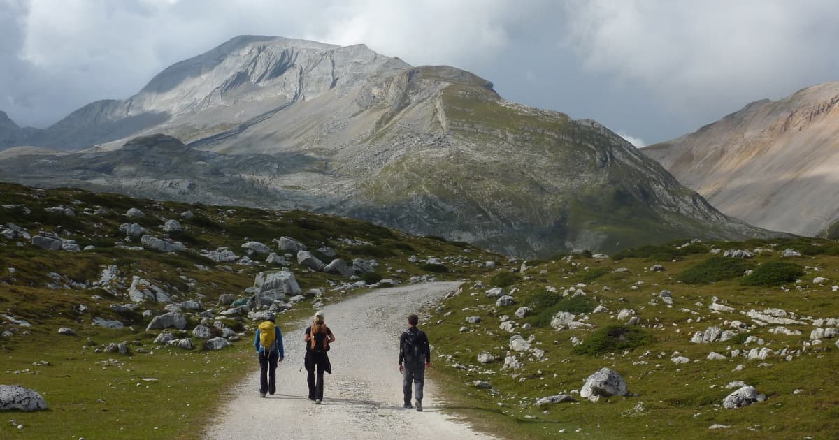 3 hikers on a mountain trail