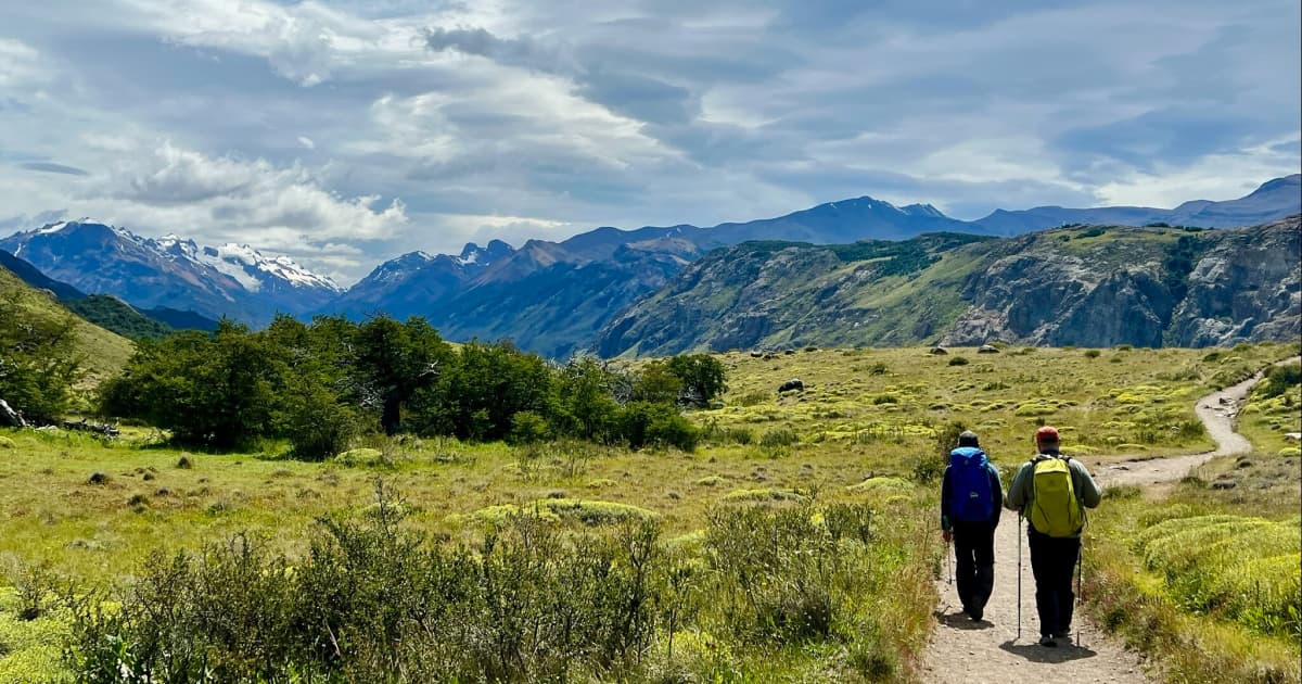 Travelers traversing a long hiking trail
