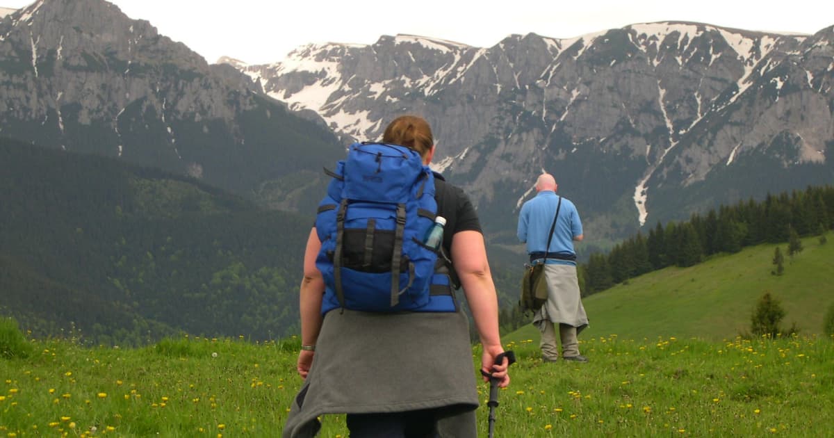 Hikers on a hiking trail leading to the Carpathian mountains