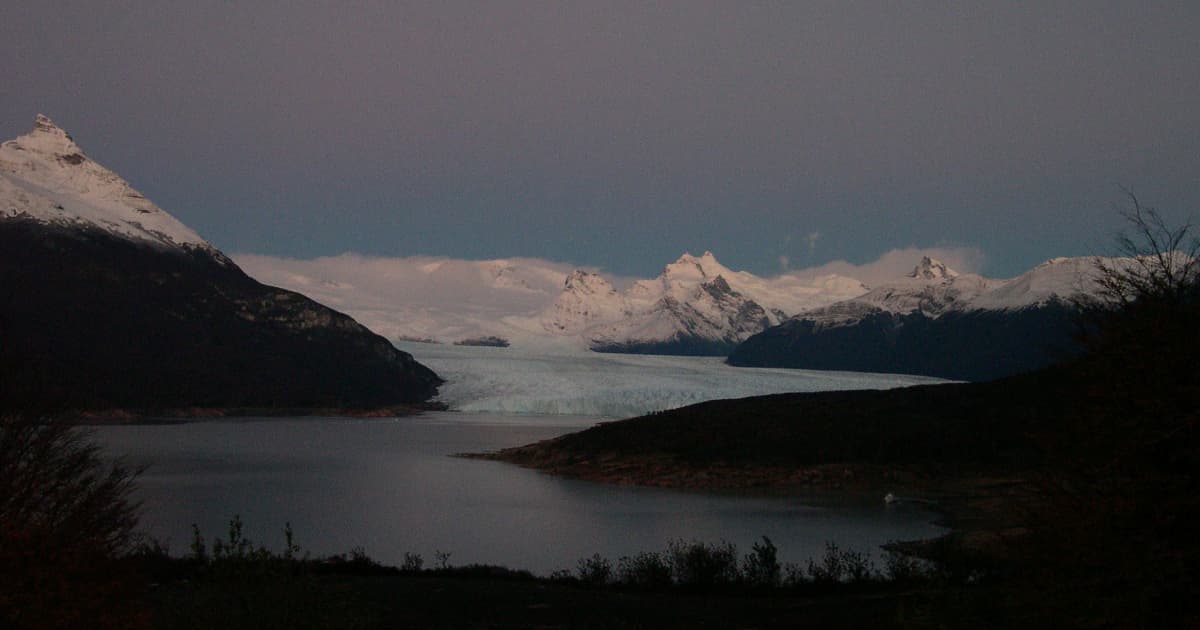 A hiking trail on a mountain at night time with very low light