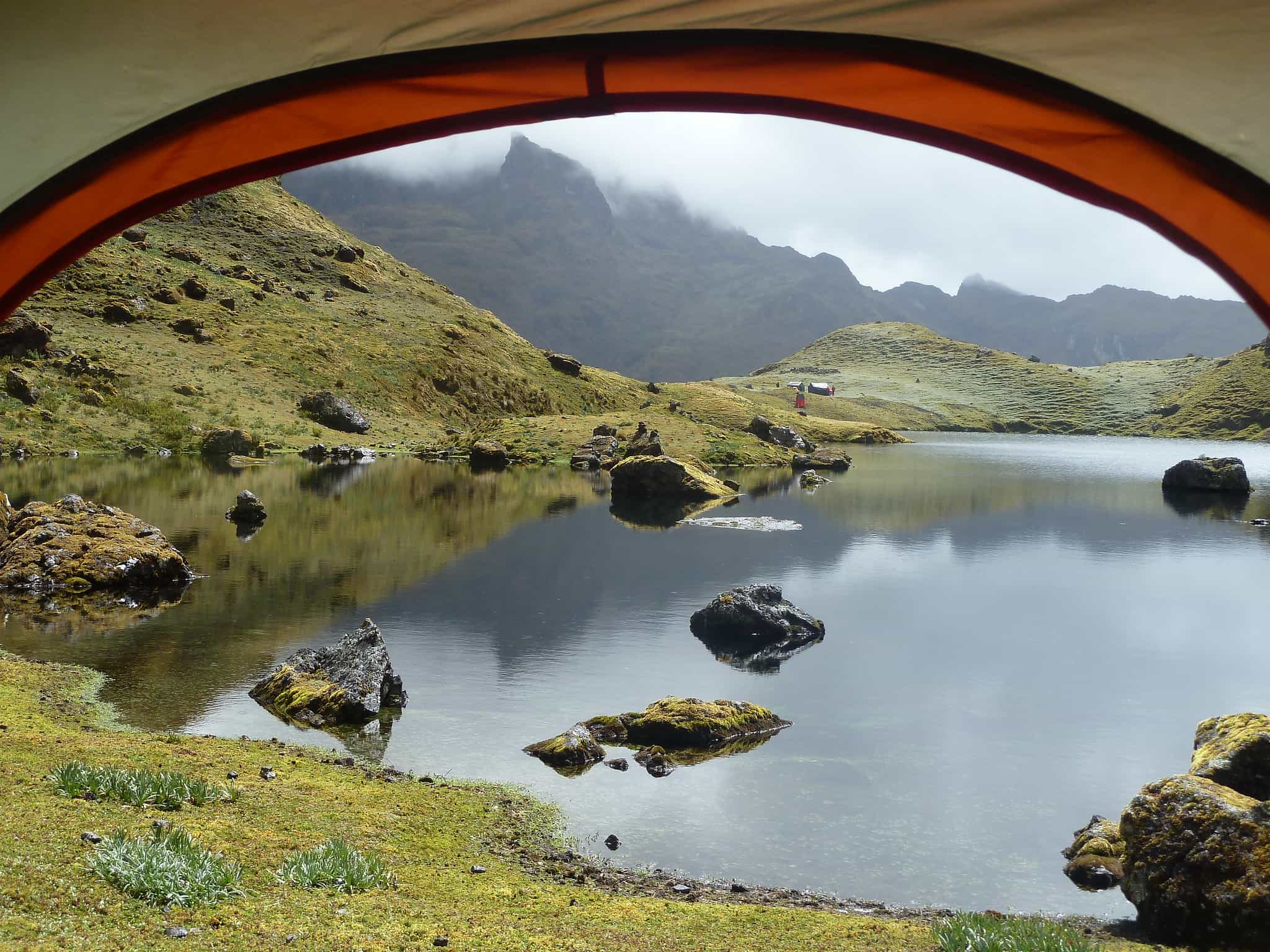 View of a lake from the inside of a tent