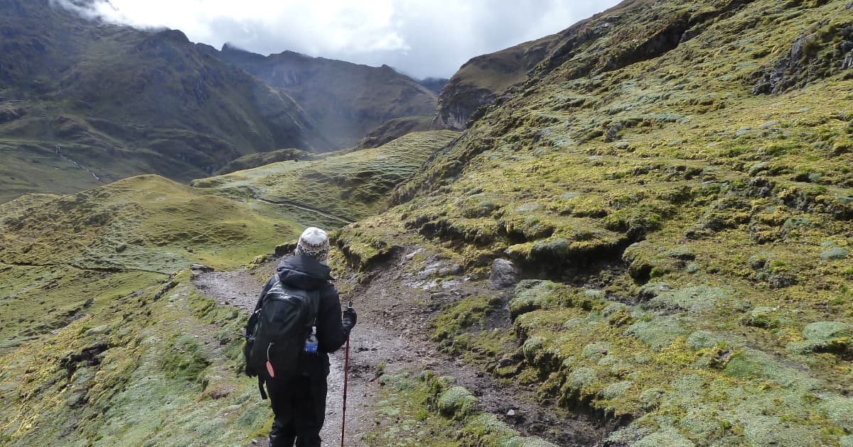 A hiker walking up the Lares trek