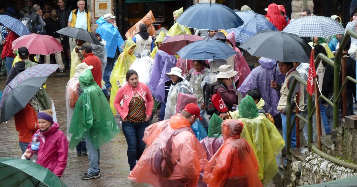 Travelers in waterproof ponchos at machu picchu