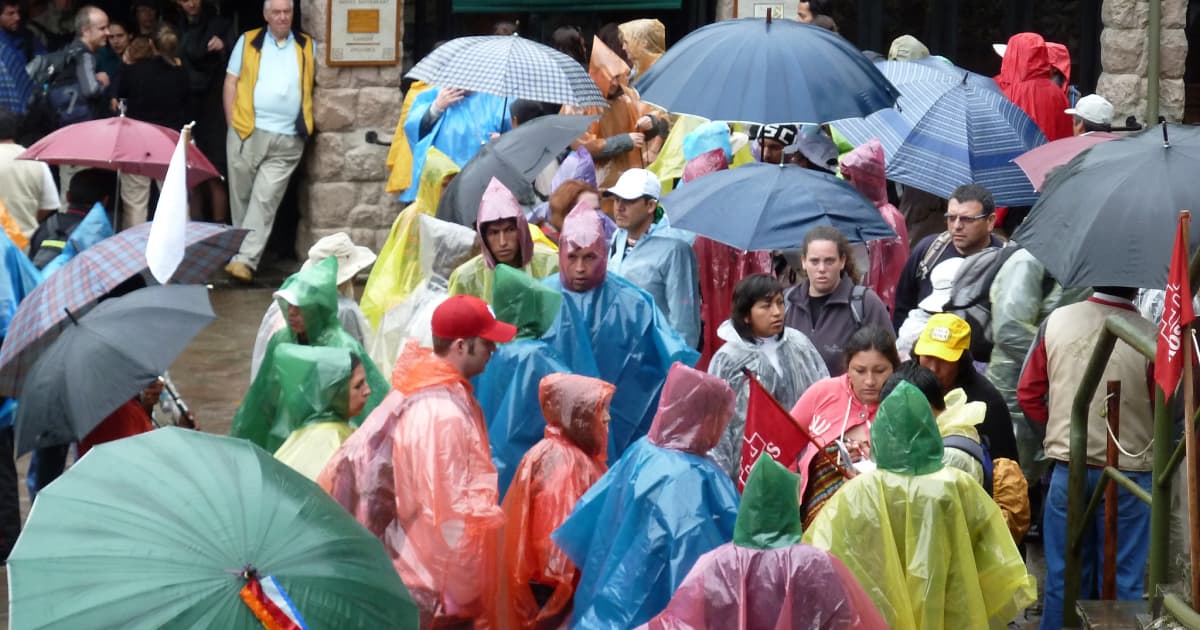 Visitors all in Ponchos at the entrance to Machu Picchu