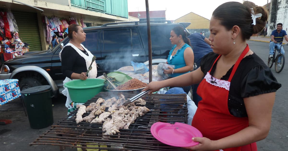 street vendor in Nicaragua serving fresh food