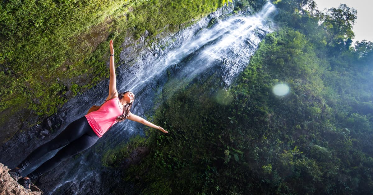 standing under a waterfall on Ometepe island