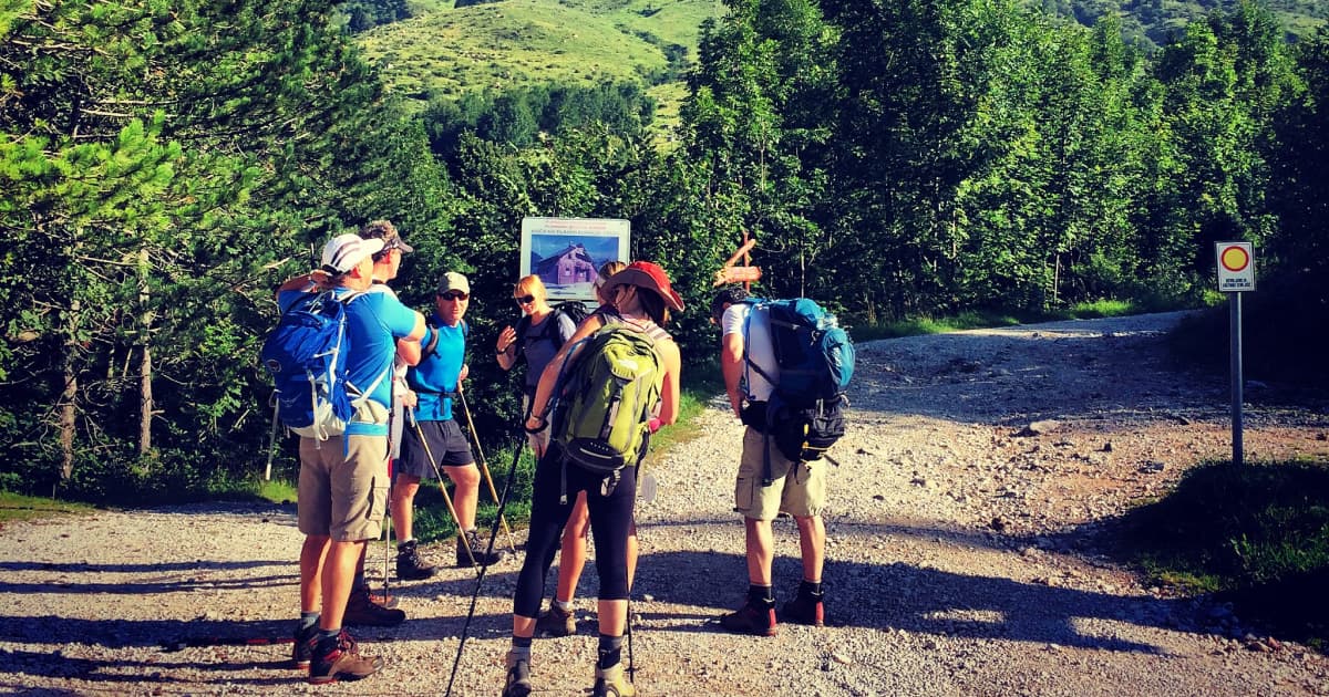 Group of hikers stopping for directions at triglav national park