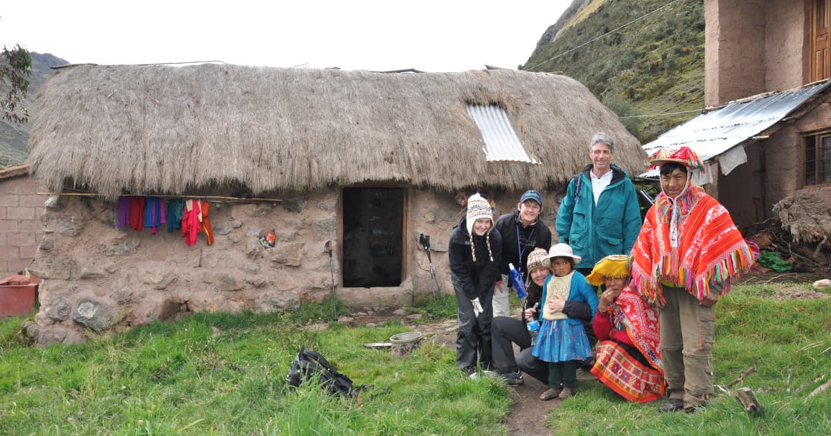 outside a homestay accommodation with a local family