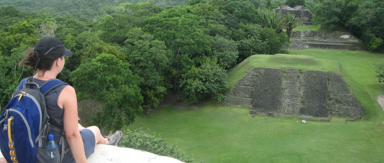Traveler overlooking Mayan ruins
