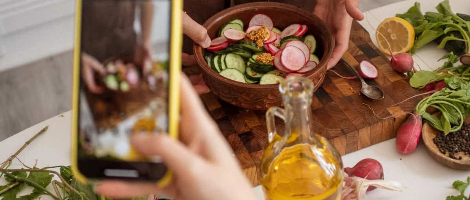 Tourist Picture of Croatian cuisine with phone