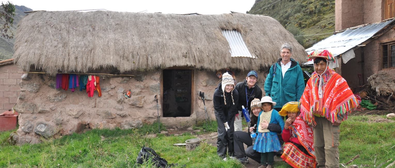 A tourist with a family at a homestay village accommodation