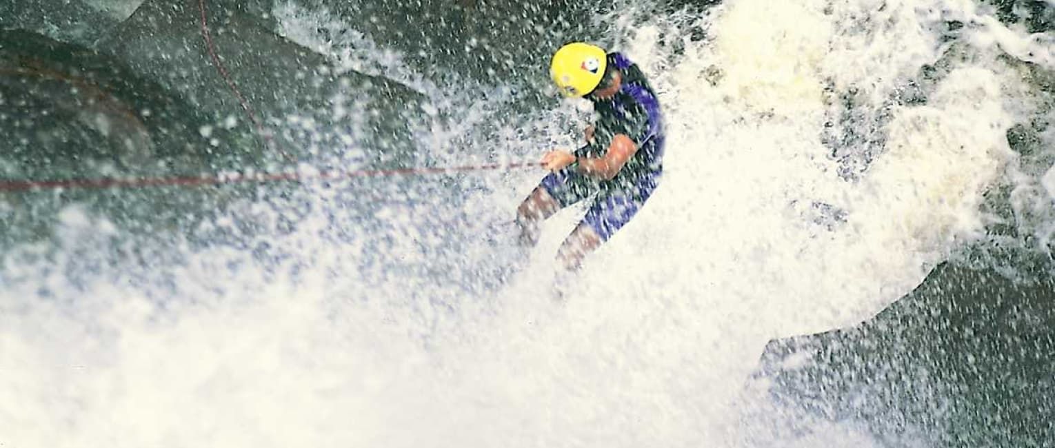 canyoneering down a waterfall