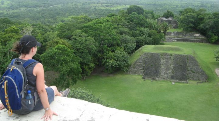 Traveler overlooking Mayan ruins
