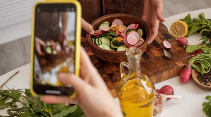 Tourist Picture of Croatian cuisine with phone