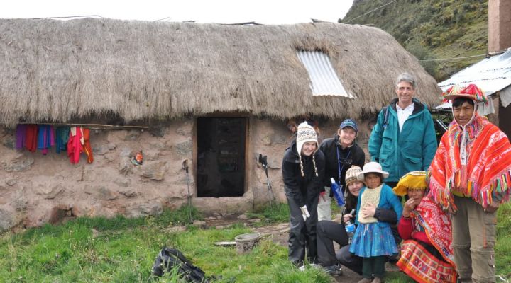 A tourist with a family at a homestay village accommodation