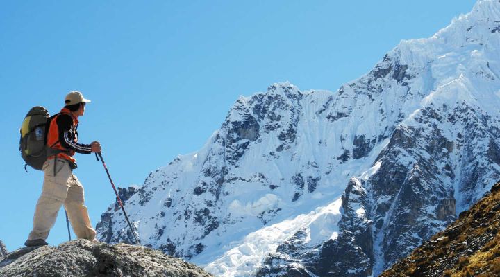 Traveler trekking snow top mountain