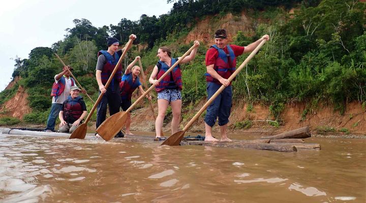 Group Paddling Down Bolivian Amazon Rainforest 