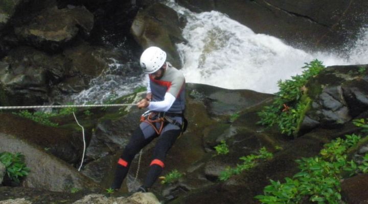 Rapelling down the side of a canyon