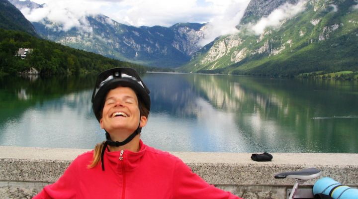 Cyclist Standing In Front Of Slovenia Lakes