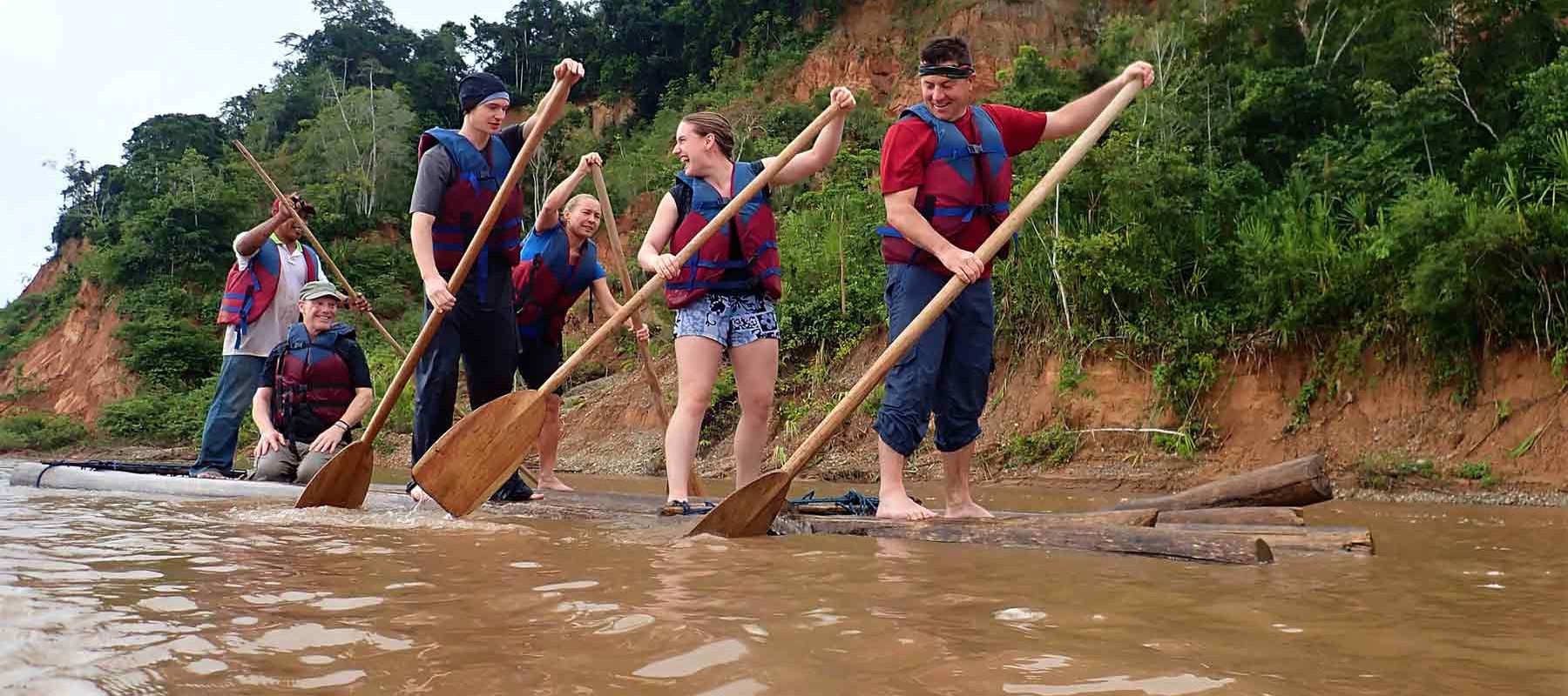 Group Paddling Down Bolivian Amazon Rainforest 