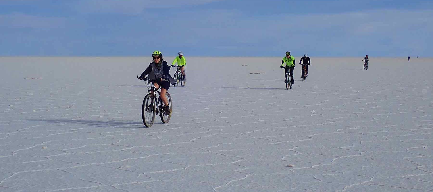 Group Biking Through Bolivia Salt Flats