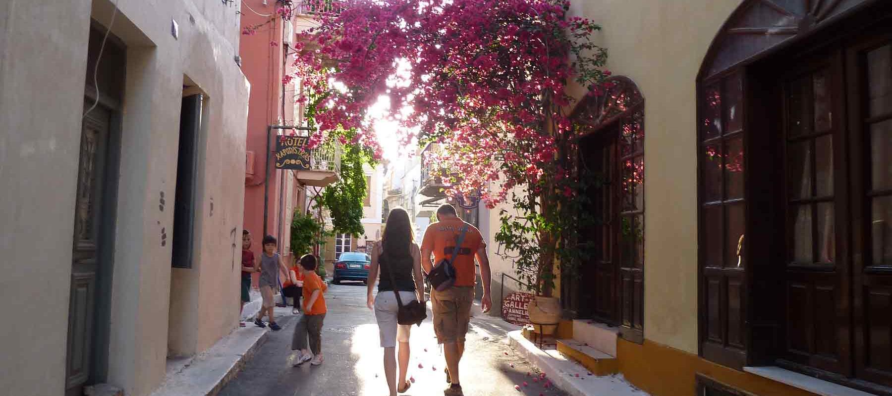 Archway with purple flowers in Athens